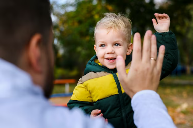 Young man and boy with raised palms